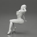 Young sexy girl in shorts with long hair is sitting with one hand in hair - Only-Games