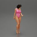 Beautiful girl in onepiece bikini standing on the beach - Only-Games