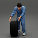 Mechanic worker walking and rolling tyre - Only-Games