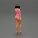 Beautiful girl in onepiece bikini standing on the beach - Only-Games