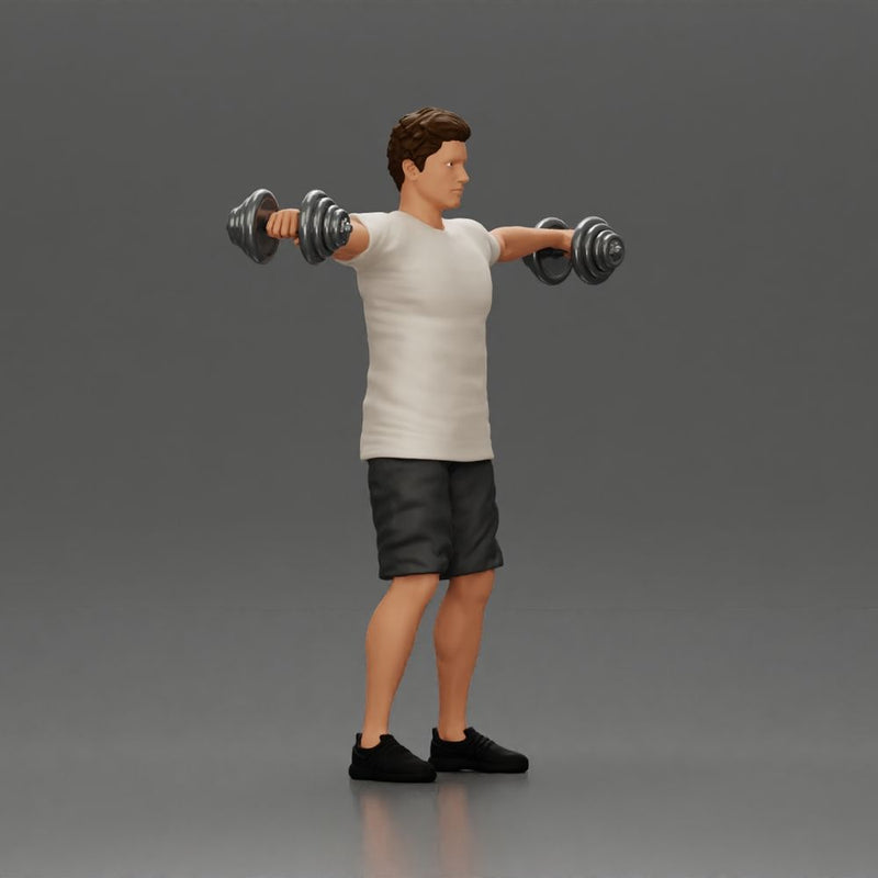 Man in the gym performing shoulder exercises with weights