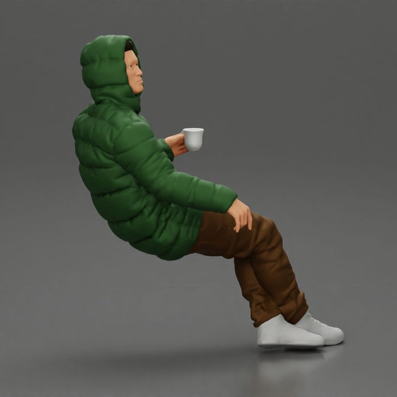 Man Sitting Wearing a Puffer Jacket, Holding a Coffee Cup - Only-Games
