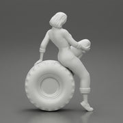 2 Models - Sexy girl mechanic in suit sitting on a truck tyre 2 - Only-Games