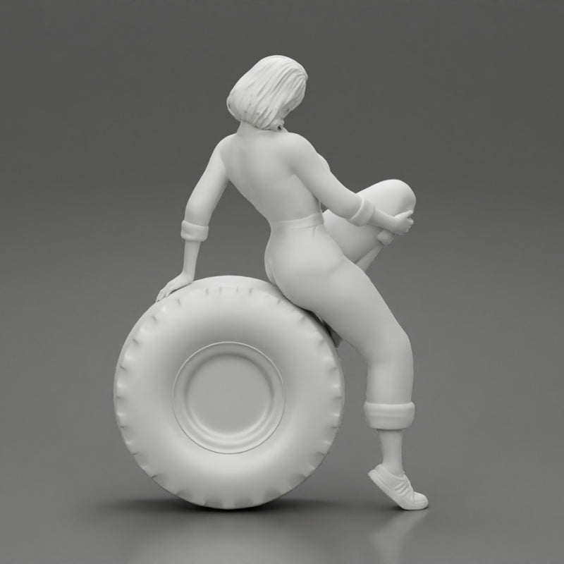 2 Models - Sexy girl mechanic in suit sitting on a truck tyre 2 - Only-Games