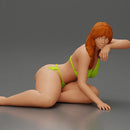 attractive girl in a bikini, lying and reclining gracefully on the beach - Only-Games