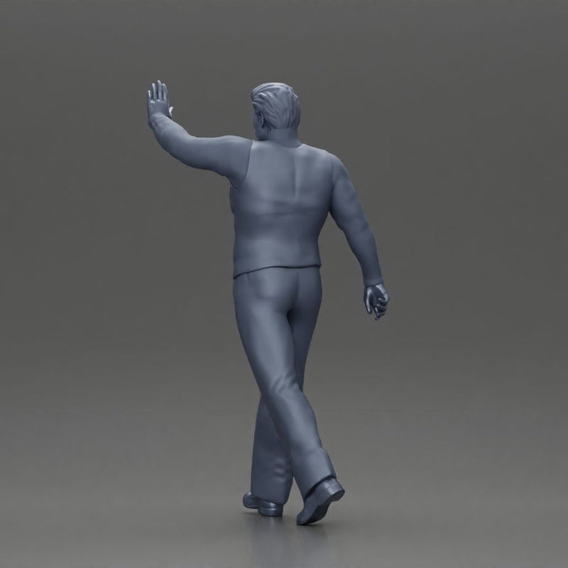 man in suit raising hand up walking