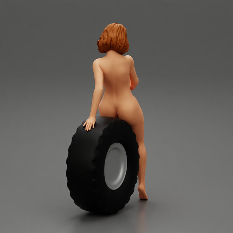 Sexy naked girl sitting on a truck tyre - Only-Games