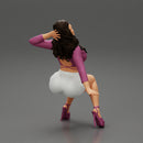 Young sexy girl in shorts with long hair is sitting with one hand in hair - Only-Games