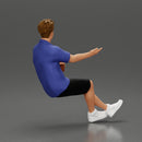 Man in shorts sitting explaining and holding a drink - Only-Games