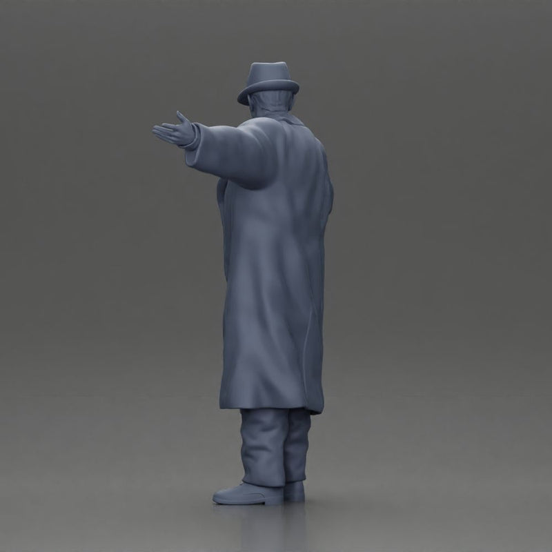 mafia man in gangster costume stands confidently while gesturing with his hands as if presenting something