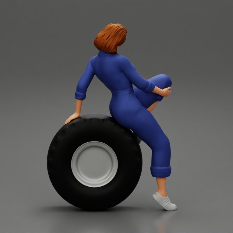 2 Models - Sexy girl mechanic in suit sitting on a truck tyre 2 - Only-Games