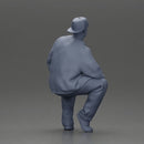 hip hop man sitting in a jacket and cap - Only-Games