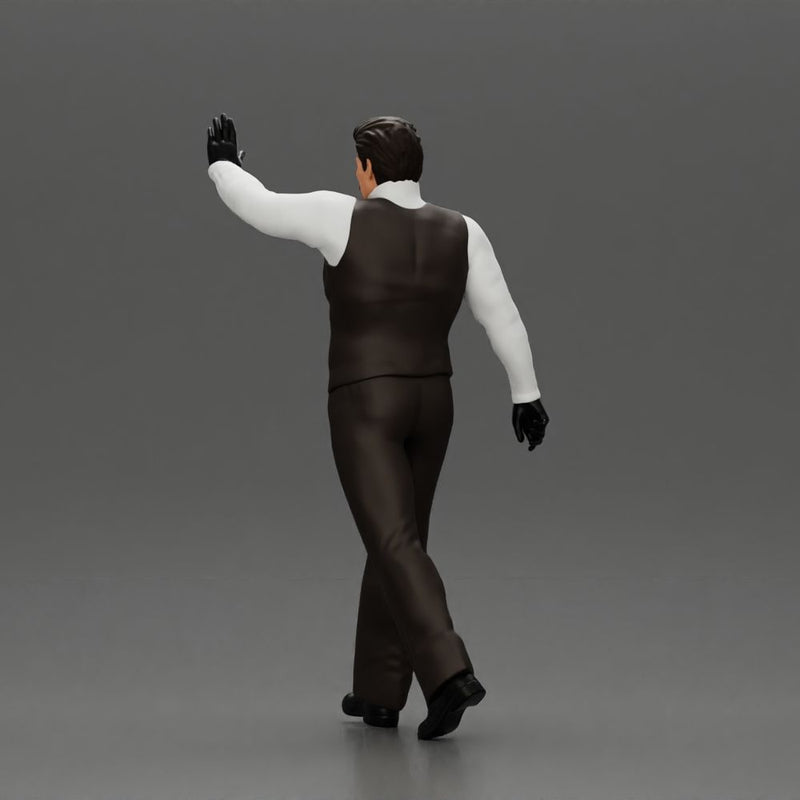 man in suit raising hand up walking