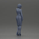 beautiful girl in a mini dress and heels with short hair places her hand on her neck - Only-Games