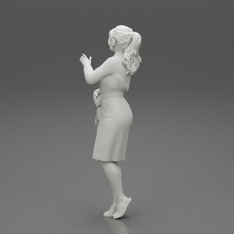 woman in bathrobe standing - Only-Games