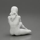 Woman photographer in bikini sitting and holding a camera - Only-Games