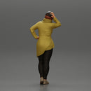 Asian girl in a neck hoodie and cap is standing and thinking - Only-Games