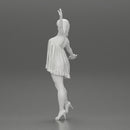 Happy Young Woman in dress and heels Standing on One Leg holding phone - Only-Games