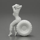 2 Models - SEXY GIRL MECHANIC IN SUIT SITTING ON A TRUCK TYRE AND HANDS IN HAIR - Only-Games