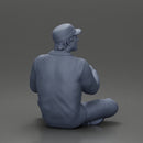 Jamie Farr sitting while eating breakfast in the MASH series - Only-Games