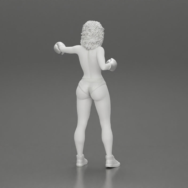 black naked breasts woman in boxing gloves with curly hair ready to finish off her opponent - Only-Games