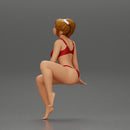 sexy girl in a bikini posing on the beach sitting at the deck chair - Only-Games