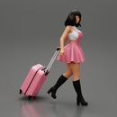 2 Young woman in sexy dress and boots pulling suitcase  walking in airport terminal - Only-Games