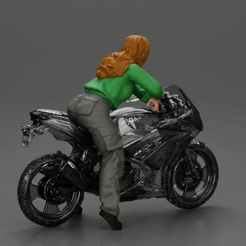 motorcyclist woman hoodie sitting on motorcycle