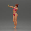 attractive woman in bikini taking a selfie with her phone on the beach - Only-Games