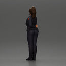 policewoman standing hand resting on her back speaking into a radio - Only-Games