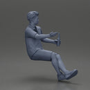 Man in shorts sitting explaining and holding a drink - Only-Games