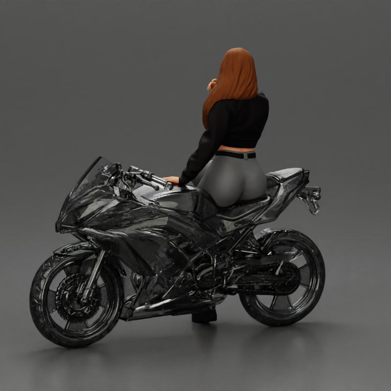 Beautiful girl in sunglasses and  mini jacket sitting on the motorbike