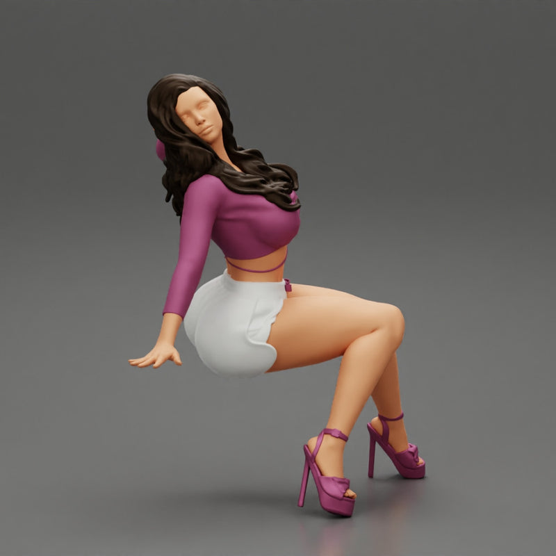 Young sexy girl in shorts with long hair is sitting with one hand in hair - Only-Games