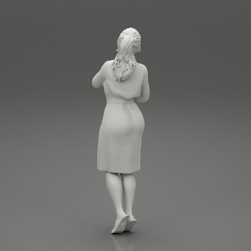 woman in bathrobe standing - Only-Games