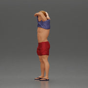 muscular man in shorts taking off his shirt to go swimming - Only-Games