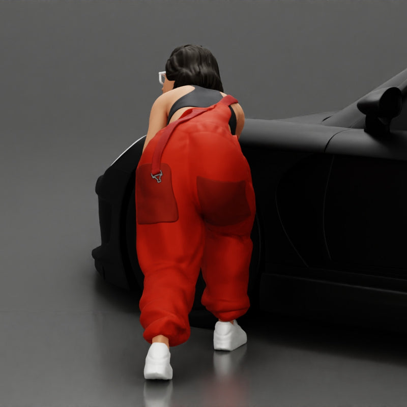 Girl mechanic in overalls turns off the front wheel of  car with a key for removing the wheel - Only-Games