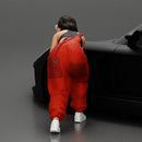 Girl mechanic in overalls turns off the front wheel of  car with a key for removing the wheel - Only-Games