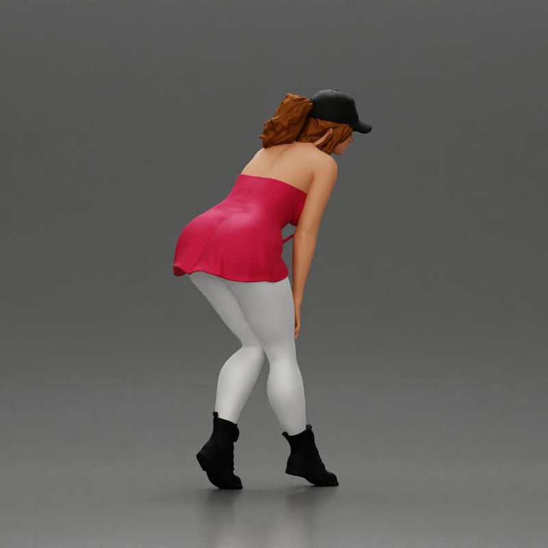 beautiful woman placing her hand on her legs, wearing a cap and a bra top - Only-Games