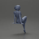 beautiful girl in dress sitting outside with her short hair blowing in the wind - Only-Games