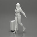 2 Fashion woman in jacket and boots dragging suitcase  walking in airport terminal - Only-Games