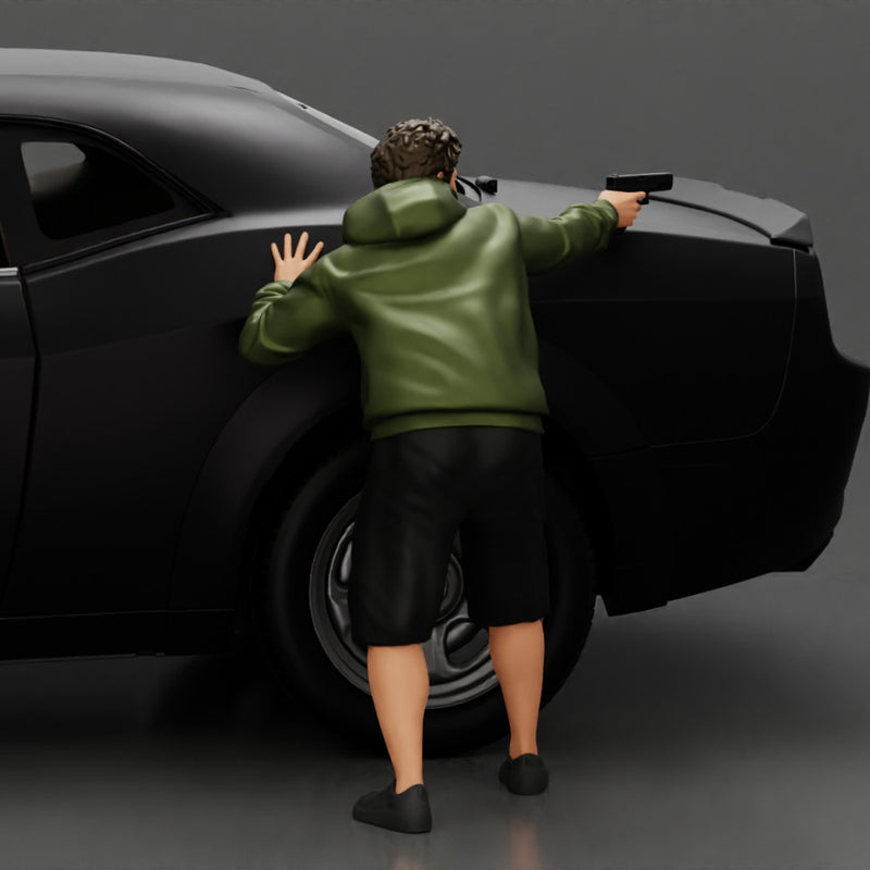 gangster man in a hoodie and shorts shooting a gun behind the car