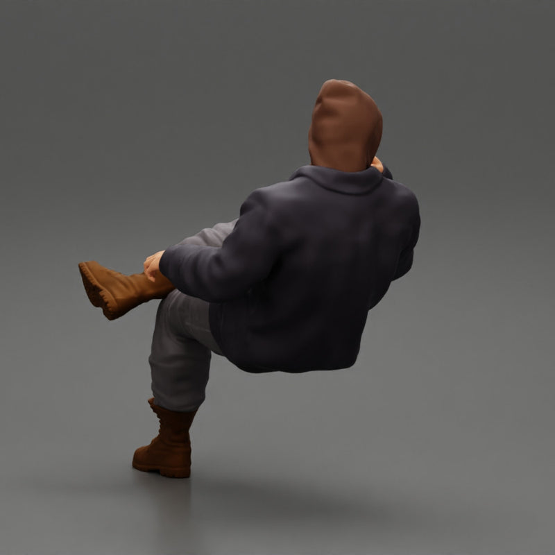 man in leather jacket and jeans sitting cross legged and thinking - Only-Games