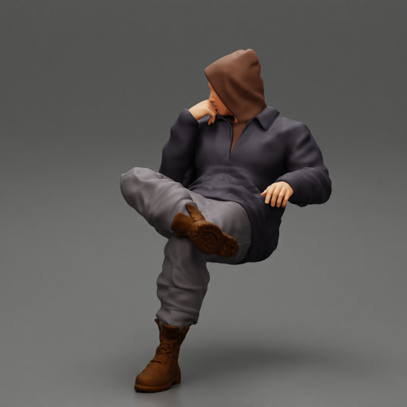 man in leather jacket and jeans sitting cross legged and thinking - Only-Games