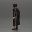 bearded man stands confidently adorned in a stylish hoodie and a flowing long coat - Only-Games