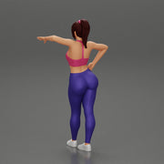 Sexy fitness girl leaning on a wall while standing outdoors - Only-Games
