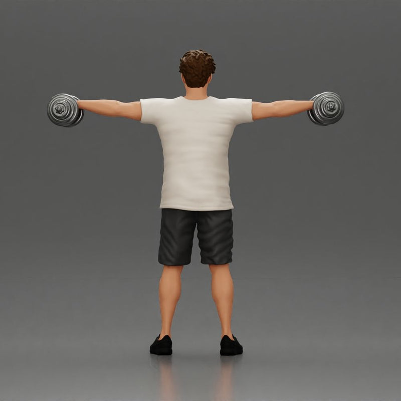 Man in the gym performing shoulder exercises with weights