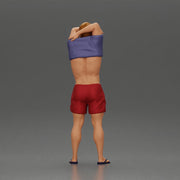muscular man in shorts taking off his shirt to go swimming - Only-Games
