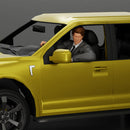 businessman sitting in his car holding steering wheel leaning his left arm on the window - Only-Games