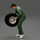 Auto mechanic walking and carrying tyre - Only-Games