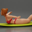 surfer girl with effortless grace, lying on her surfboard as she rides the wave - Only-Games